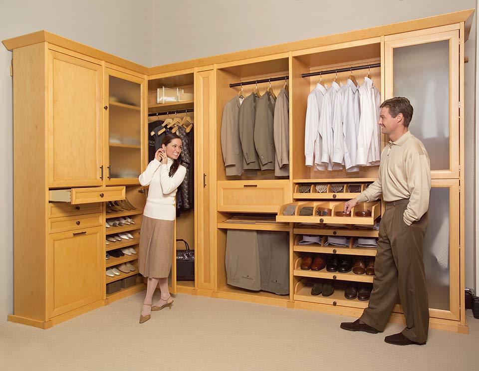 custom walk in closet, man and woman getting ready, cherry wood